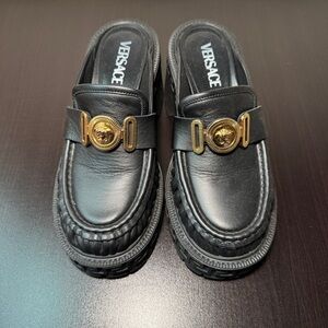 Versace Women’s Loafers in Black with Gold Detailing